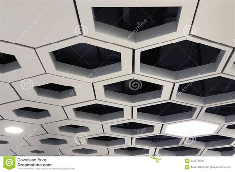 The really nice thing about dropped, or suspended ceiling tiles is that when one section of the ceiling is damaged or stained, you won't have to replace the whole thing or struggle to blend a patched area into the existing ceiling. Drop Ceiling. Hexagon Aluminium Cell Tiles. Stock Photo ...
