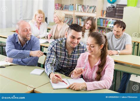 Adult Students Writing In Classroom Stock Photo Image Of European