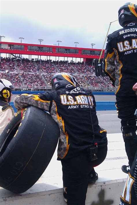 Pit road is crowded before a nascar race. NASCAR Pit Crew | A tire gets ready to be changed at the ...