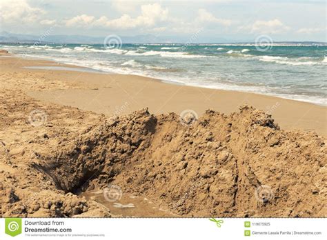 Hole Dug Into The Sand Of Beach Stock Image Image Of Segura Seashore