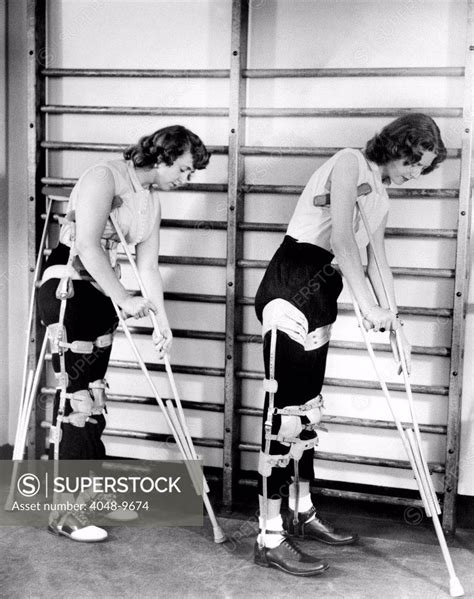 Two Adult Women Polio Victims With Leg Braces Adjust Their Crutches They Are At The New York