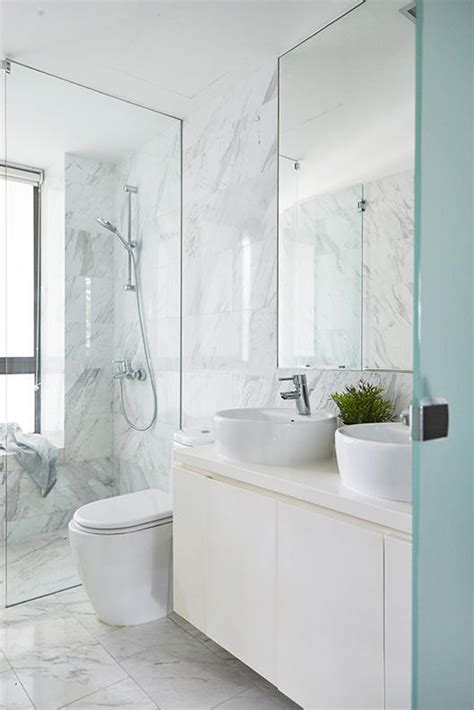 The floating vanity and mirror span the full wall, and a tile accent strip resembling a leaf vein adds movement and a touch of color to the space. 8 minimalist bathrooms that will stand the test of time ...