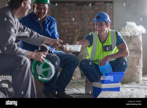 Three Construction Workers Having Lunch Stock Photo Alamy
