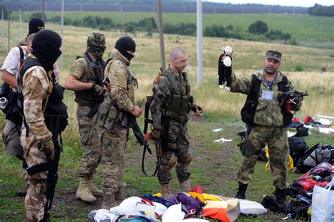Pro Russian Militants Pick Through Debris At Jet Crash Site