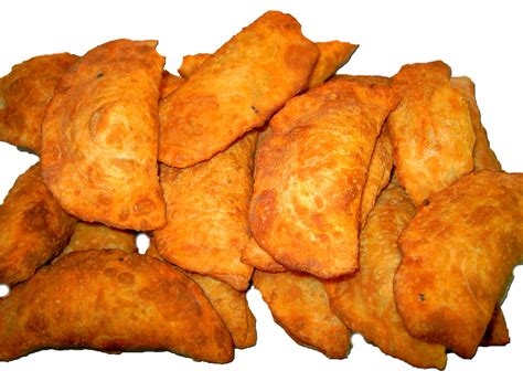 2 empanadas / 8 stücke. Empanada - gefüllte Teigtaschen - Lebensmittelfotos.com