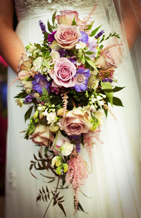 Brides n blooms, wholesale & designs white lily & rose bouquet. Next image >> | Wedding flowers, Cascading wedding ...