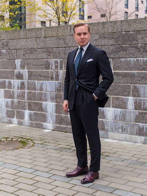 Finished with a low block heel to complete a suave look. Combining a Grey Suit with Burgundy Shoes