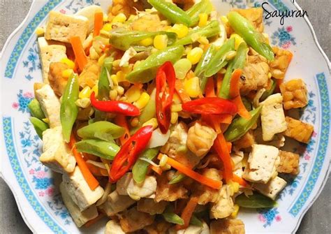 Masak hingga mendidih dan gula larut Resep Tumis Tahu Tempe dan Sayuran oleh Dapur ala mama ...