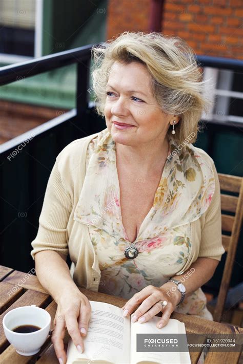 Happy mature woman — Hot Drink, sweden - Stock Photo | #151920944