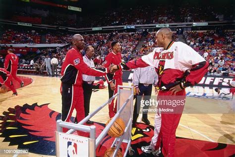 Michael Jordan Of The Chicago Bulls Shakes Hands With Steve Smith Of