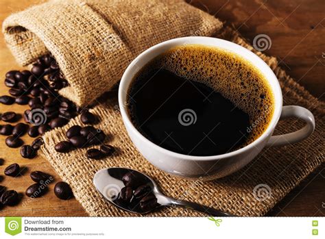 Coffee Cup With Coffee Bean In Still Life Stock Photo