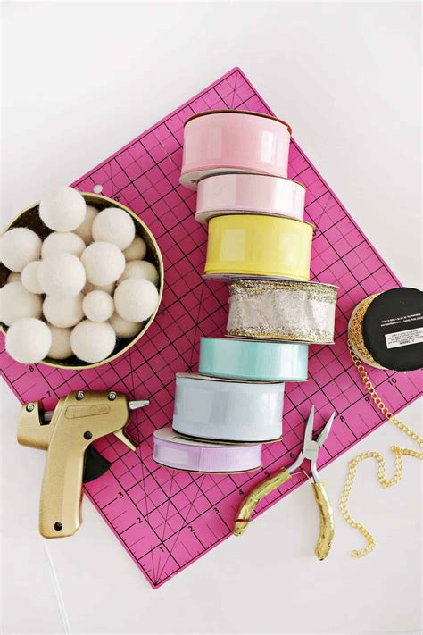 I alternated red and white ribbon, but you can do whatever you'd like. Kid's Ribbon Rainbow Wall Hanging DIY - A Beautiful Mess