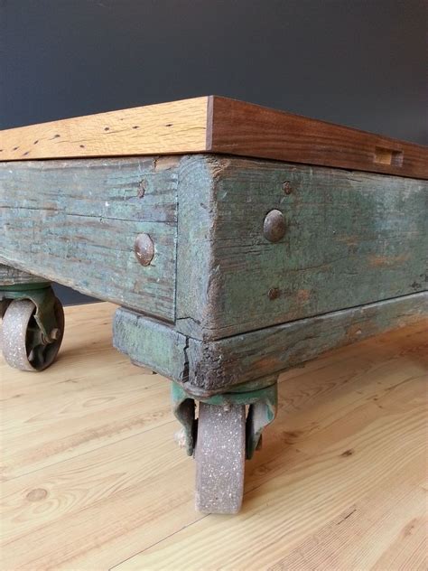 An iron shelf provides extra storage for books or games. Hand Made Industrial Blue Cart Coffee Table by re.dwell ...