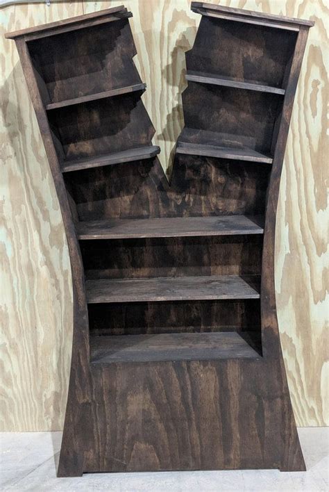 If the idea of diy shelving terrifies you, consider this alternative book storage hack: Cracked-In-Half Split Bookshelf Unique Whimsical Design ...