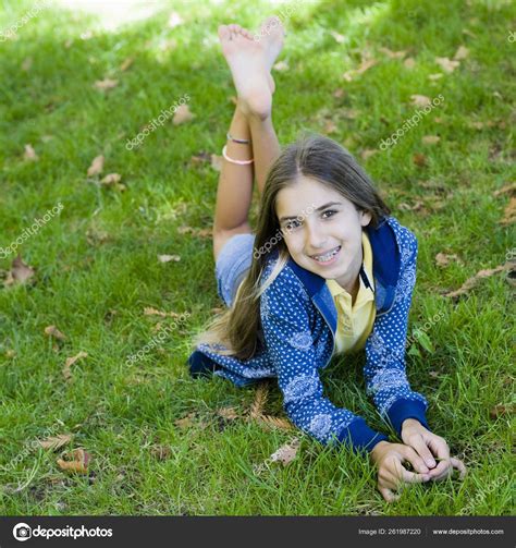 Portrait Smiling Tween Girl Lying Grass Smiling Camera Stock Photo By YAYImages