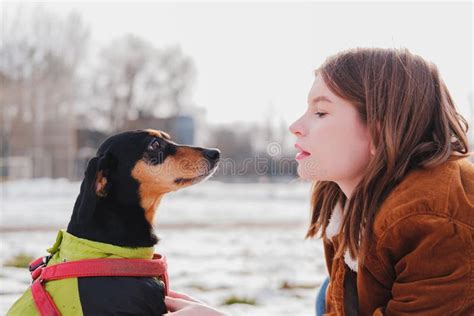 Portrait Of A Young Woman And Her Lovely Dachshund Dog Stock Image