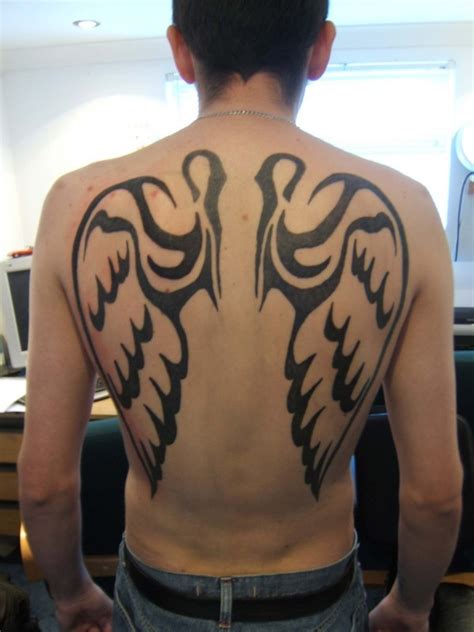 This is a very busy tattoo. tattoo new : 2012: Wings Tattoos For Men