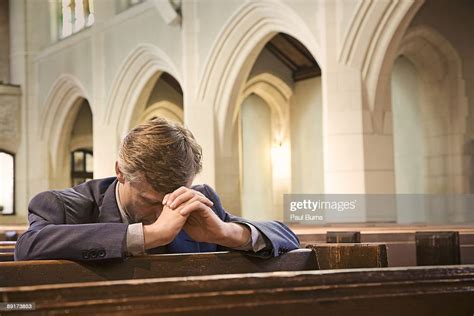 Man Kneeling And Praying In Church Bildbanksbilder Getty Images