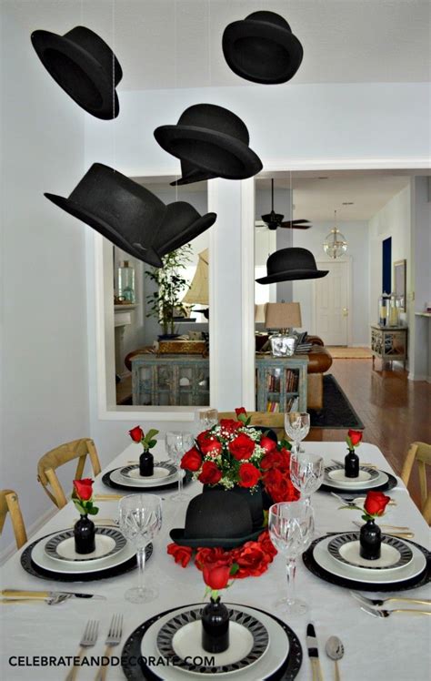 Derbys And Top Hats Hang Above A Table Celebrating The Graduate With