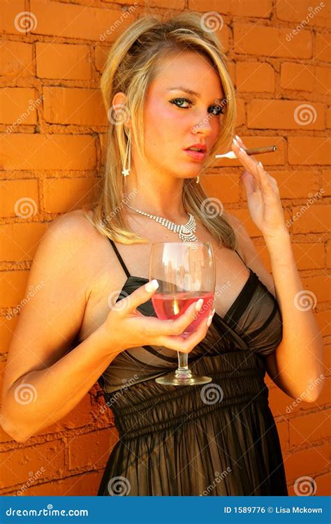 Blonde Model Woman Smoking Cigar With A Drink Of Wine Royalty Free Stock Image Image 1589776