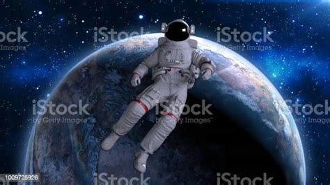 Astronaut Floating Back Above Planet Earth Cosmonaut Drifting In Space