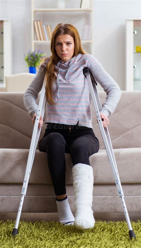 Young Woman With Broken Leg At Home Stock Image Image Of Crutch