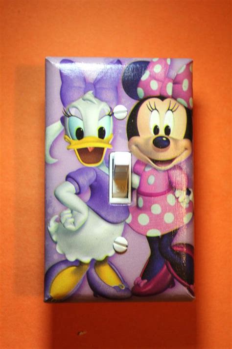 Looking for the coolest minnie decor? Disney Minnie Mouse and Daisy Light Switch Plate by ...