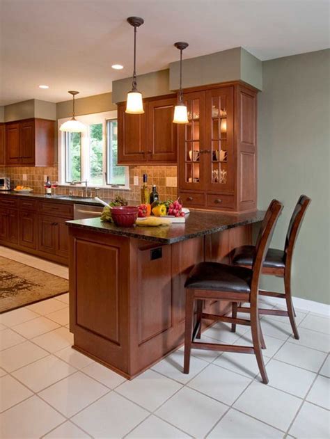The kitchen itself is designed with white beadboard cabinets, wood flooring and a creative chalkboard accent wall. Peninsula Cabinet | Houzz