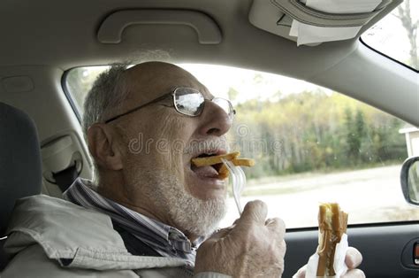 Senior Man With Expressive Face Eating Fast Foods Royalty Free Stock