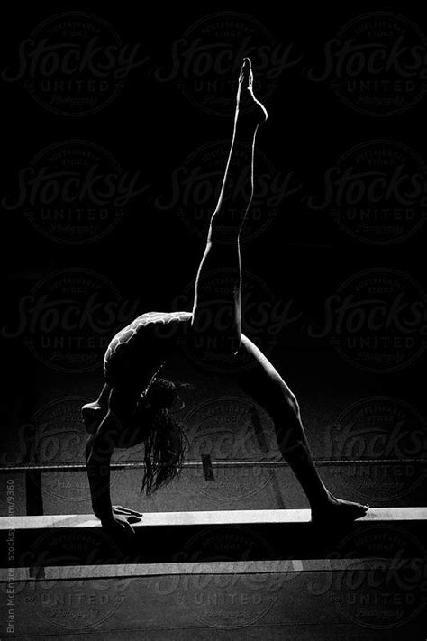 silhouetted black gymnast in back walkover by brian mcentire gymnastics photography sport