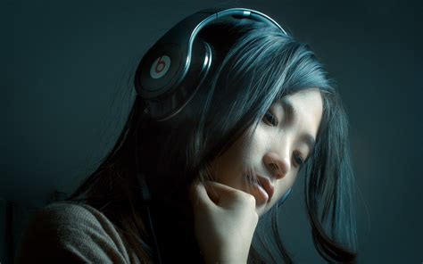 A Woman Wearing Headphones Headphone Reviews And Discussion Head