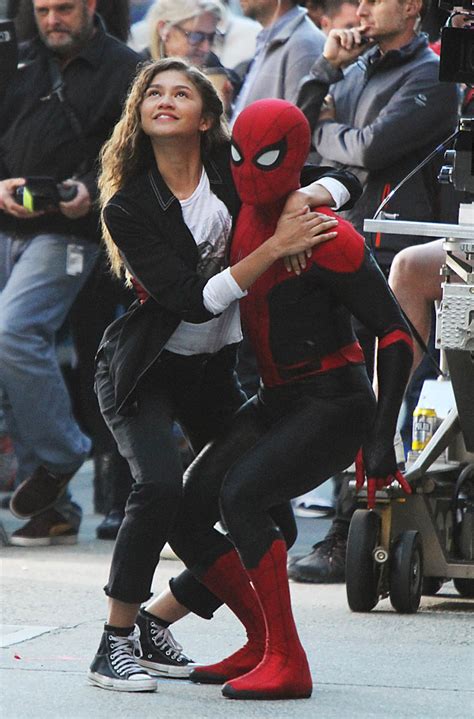 tom holland and zendaya spiderman far from home zendaya holds onto tom holland while shooting