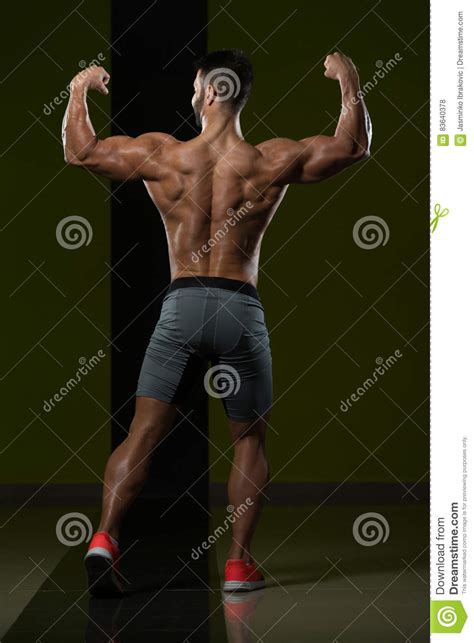 Young Bodybuilder Flexing Muscles Stock Photo Image Of Lifestyle