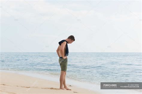 Man Standing On The Beach Caucasian Freedom Stock Photo