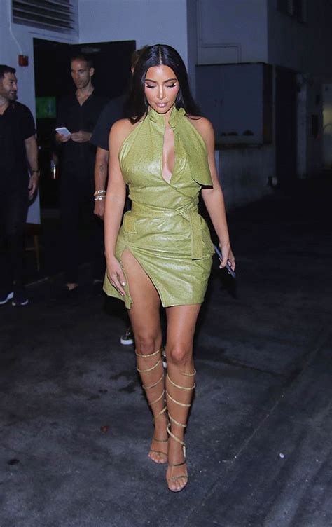 talu link kim kardashian sizzles in a gold mini dress then a white crop top and skirt for night