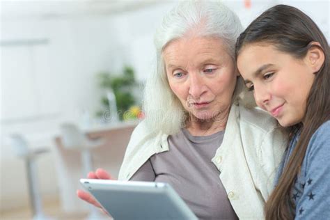 teaching granny how to use tablet stock image image of elderly happy 93764873