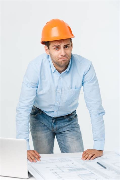 Young Man Wearing Architect Outfit And Helmet With Angry Face Negative