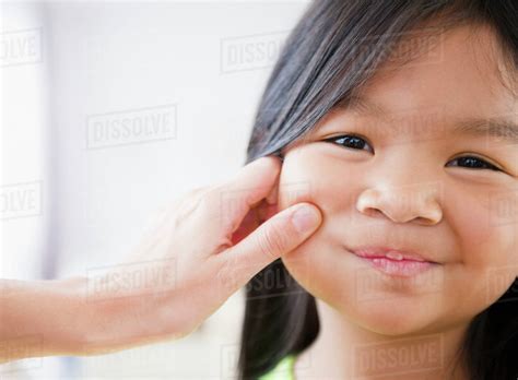 Mother Pinching Korean Girl S Cheek Stock Photo Dissolve