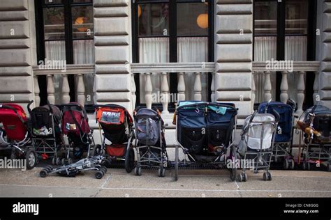 Baby Strollers Are Parked Outside A Building In New York City Stock