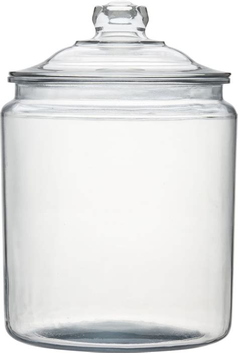 A Large Glass Jar With A Lid On The Top Is Shown In Front Of A White
