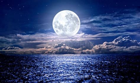 Full Moon Over The Ocean Waves With Stars At Night Stock Photo Image