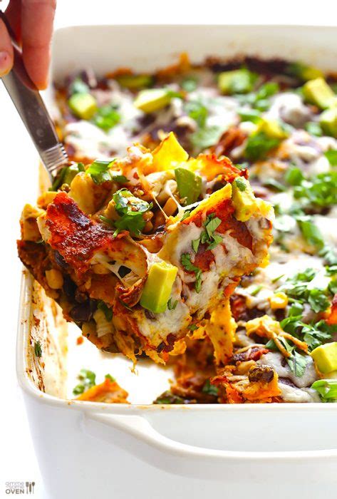 This chicken enchilada casserole is creamy cheesy perfection and it's so easy to throw together since everything is layered together instead of rolled. Chicken Enchilada Casserole - Swanky Recipes