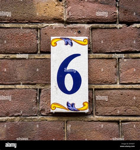 House Number Six On Ceramic Tile Blue Lettering On A White Background