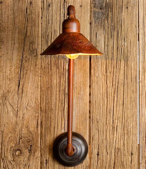 The appearance of 3 water pipes add to the vintage feel. Laurel Bay Pipe and Shade Sconce - Eclectic - Wall Sconces - by Cottage & Bungalow