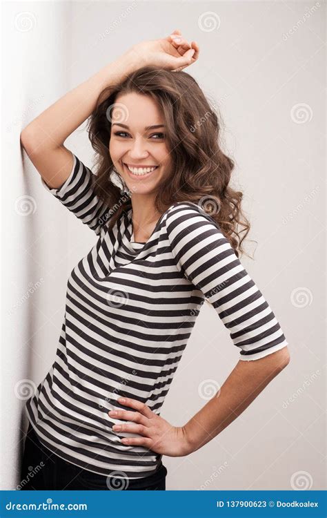 Happy Brunette Woman With Curly Hair And Perfect Smile Posing Stock Image Image Of Ecstatic