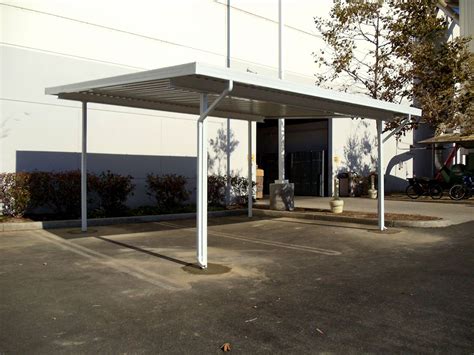 An industrial aluminum canopy can be located between two temporary, modular buildings that are close together, but they can connect permanent buildings as well. Industrial Awnings and Covers | Superior Awning