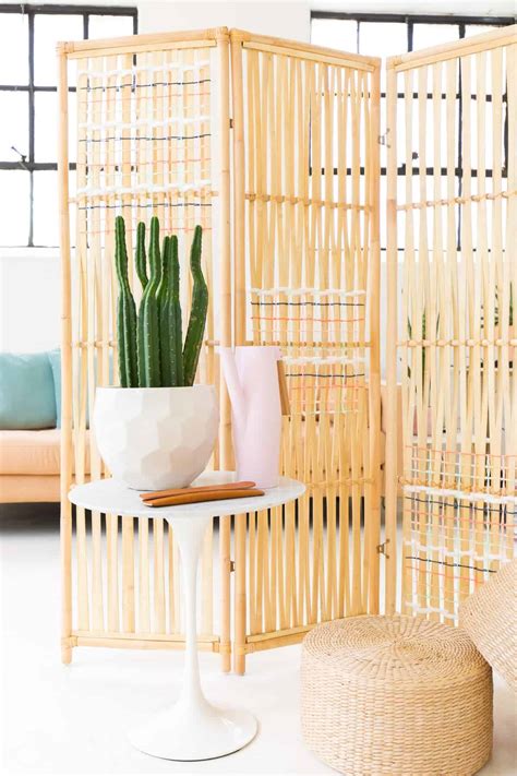 This stunning room divider storage wall uses trofast boxes to create loads of accessible, organized storage while dividing the room up nicely. DIY-Ikea-Hack-Woven-Room-Divider-4