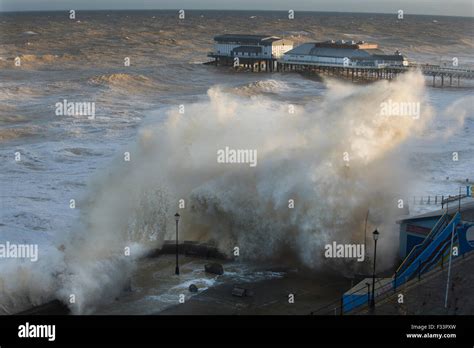 High Waves Lashing Cromer Seafront And Pier Norfolk During Storm Surge