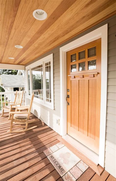 This ceiling can make a porch feel larger, add drama to the space and keep your porch cool in hotter climates. craftsman style front door wood floor ceiling lights ...