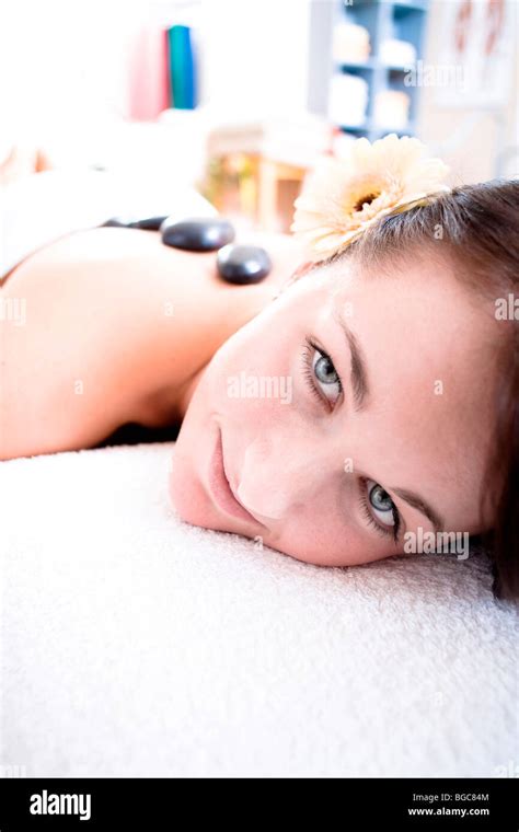 Patient In A Physiotherapy Practice Getting A Hot Stone Massage Stock